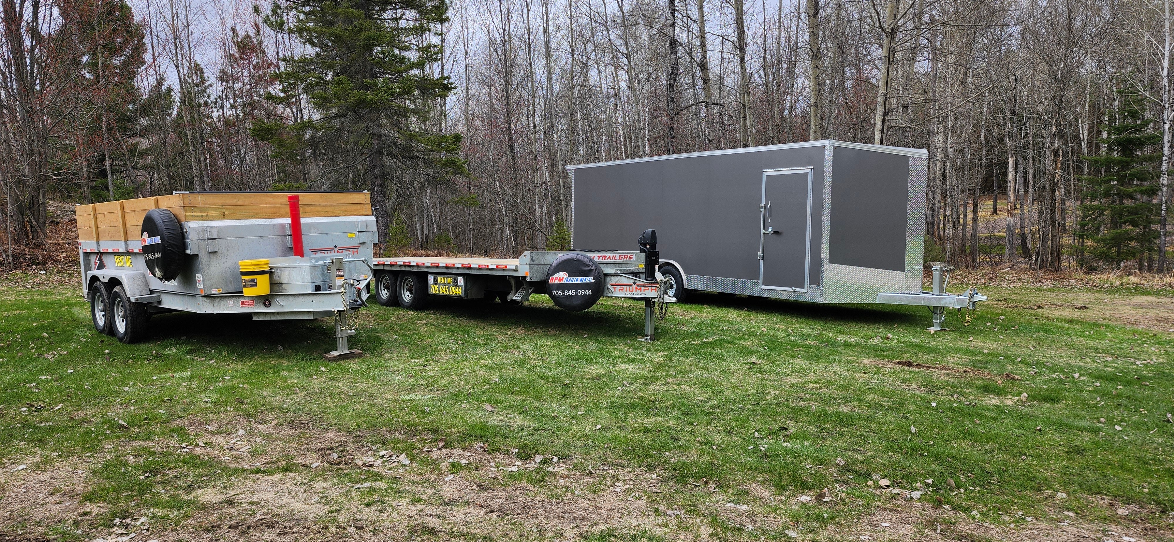 Professional RPM trailer fleet lined up showing dump trailer, tilt trailer, and enclosed trailer - quality equipment for Callander, North Bay rentals